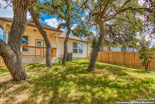 27319 Sterling Silver San Antonio, TX 78260 - Photo 26 of 28 a view of a house with a tree in the yard