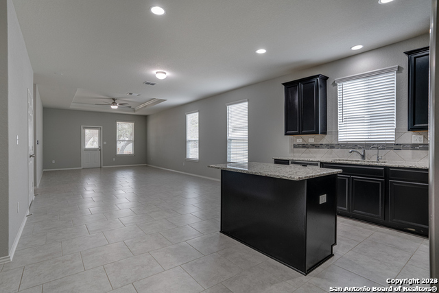 27319 Sterling Silver San Antonio, TX 78260 - Photo 10 of 28 a kitchen with granite countertop a stove and a sink