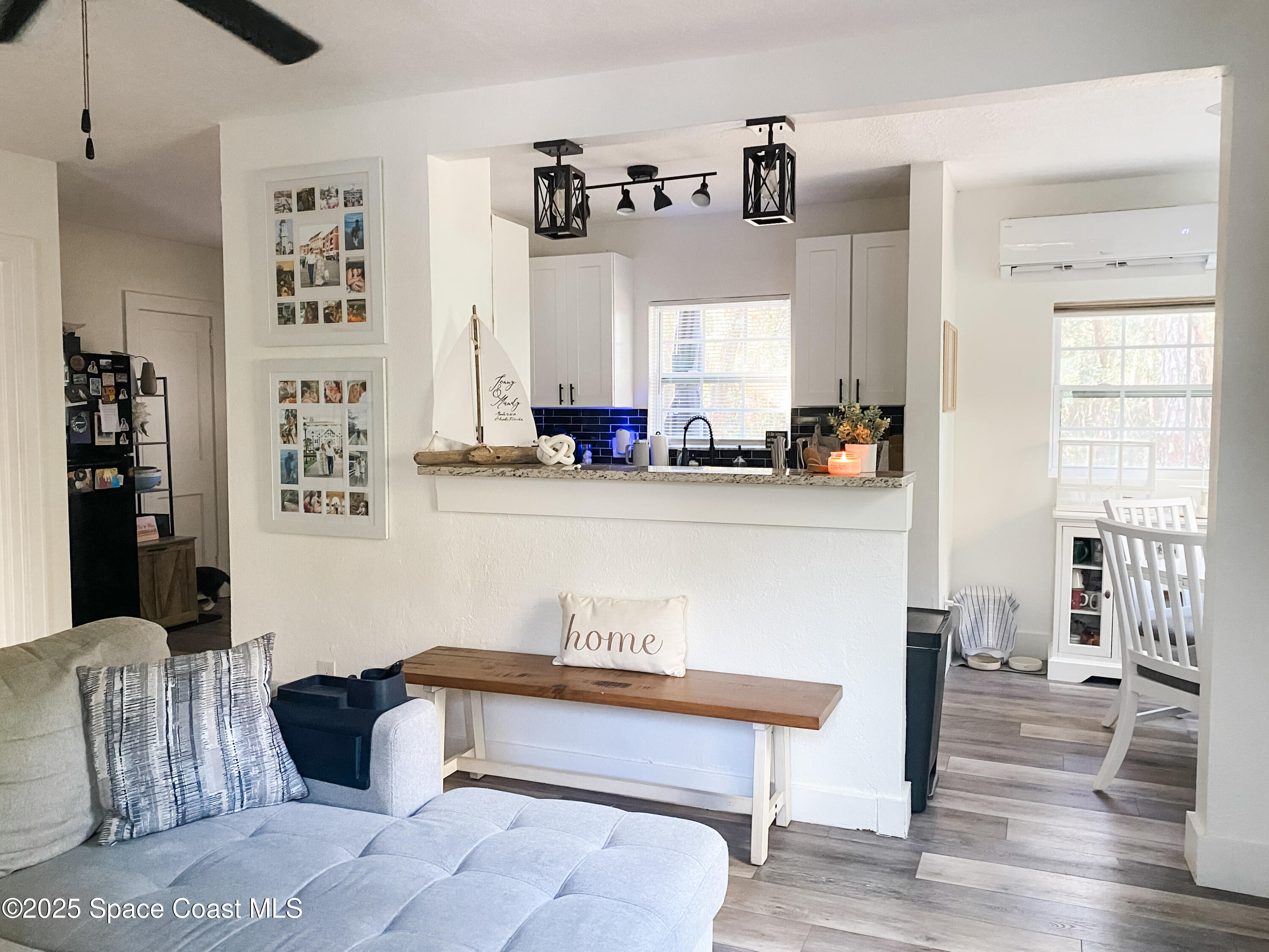 8812 Trevarthon Road Orlando, FL 32817 - Photo 12 of 22 a living room with furniture and wooden floor