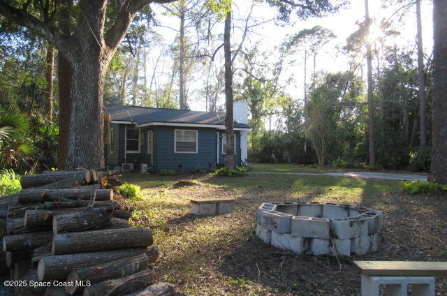 8812 Trevarthon Road Orlando, FL 32817 - Photo 18 of 22 a view of a house with backyard and sitting area