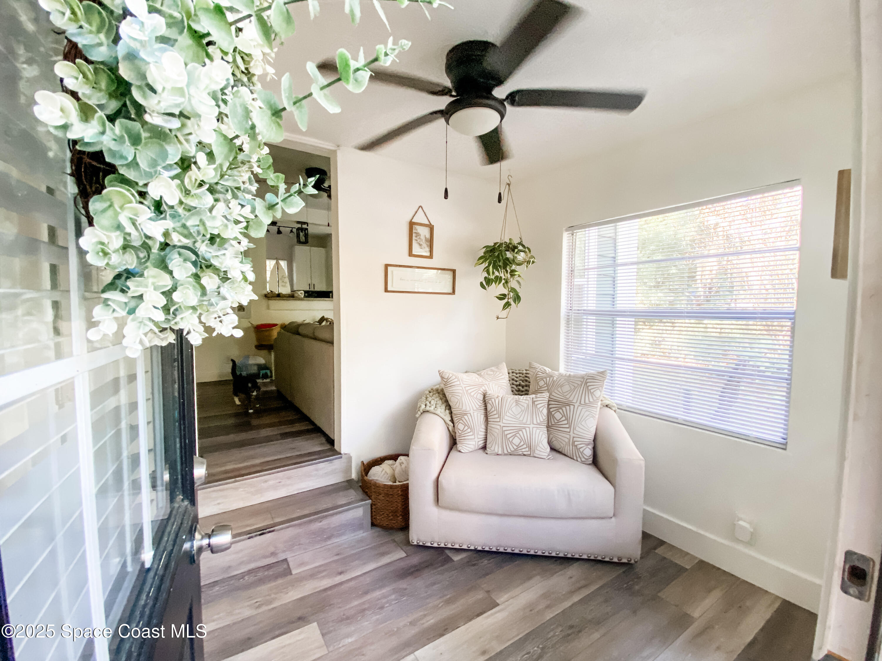 8812 Trevarthon Road Orlando, FL 32817 - Photo 3 of 22 a living room with furniture and a window