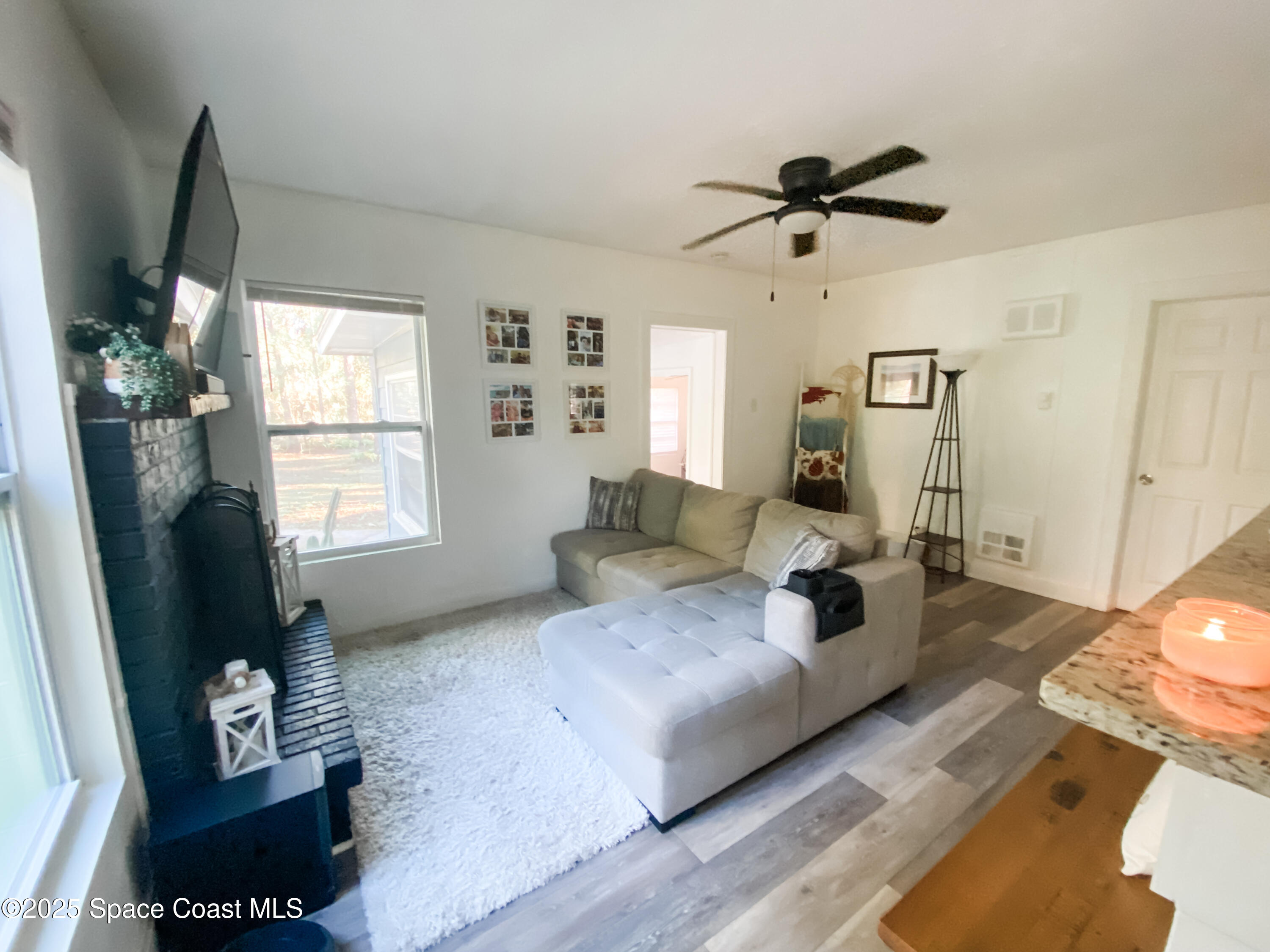 8812 Trevarthon Road Orlando, FL 32817 - Photo 5 of 22 a living room with furniture and a window