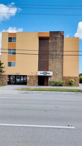 a view of a building next to a yard