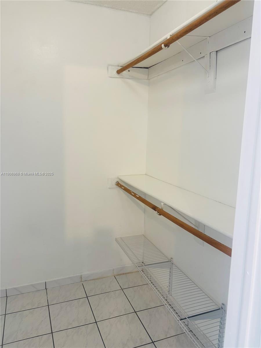 295 Northwest 72nd Avenue, Unit 401 Miami, FL 33126 - Photo 5 of 12 a close up view of racks on the wall