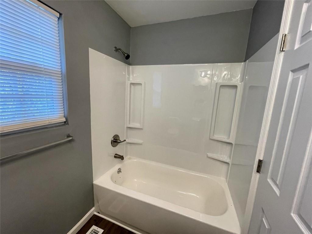 458 Daffodil Street Macon, GA 31204 - Photo 24 of 24 a bathroom with a bathtub and a shower