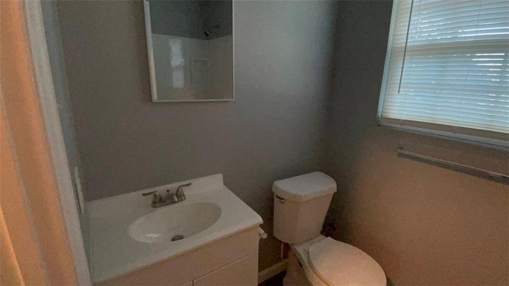 458 Daffodil Street Macon, GA 31204 - Photo 8 of 24 a bathroom with a toilet sink and mirror