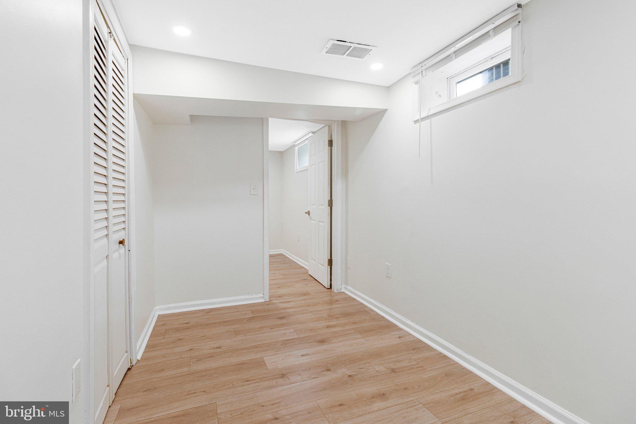 11515 Goodloe Road Silver Spring, MD 20906 - Photo 26 of 33 a view of an empty room with wooden floor