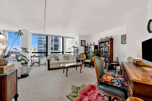 a living room with furniture fireplace and a flat screen tv