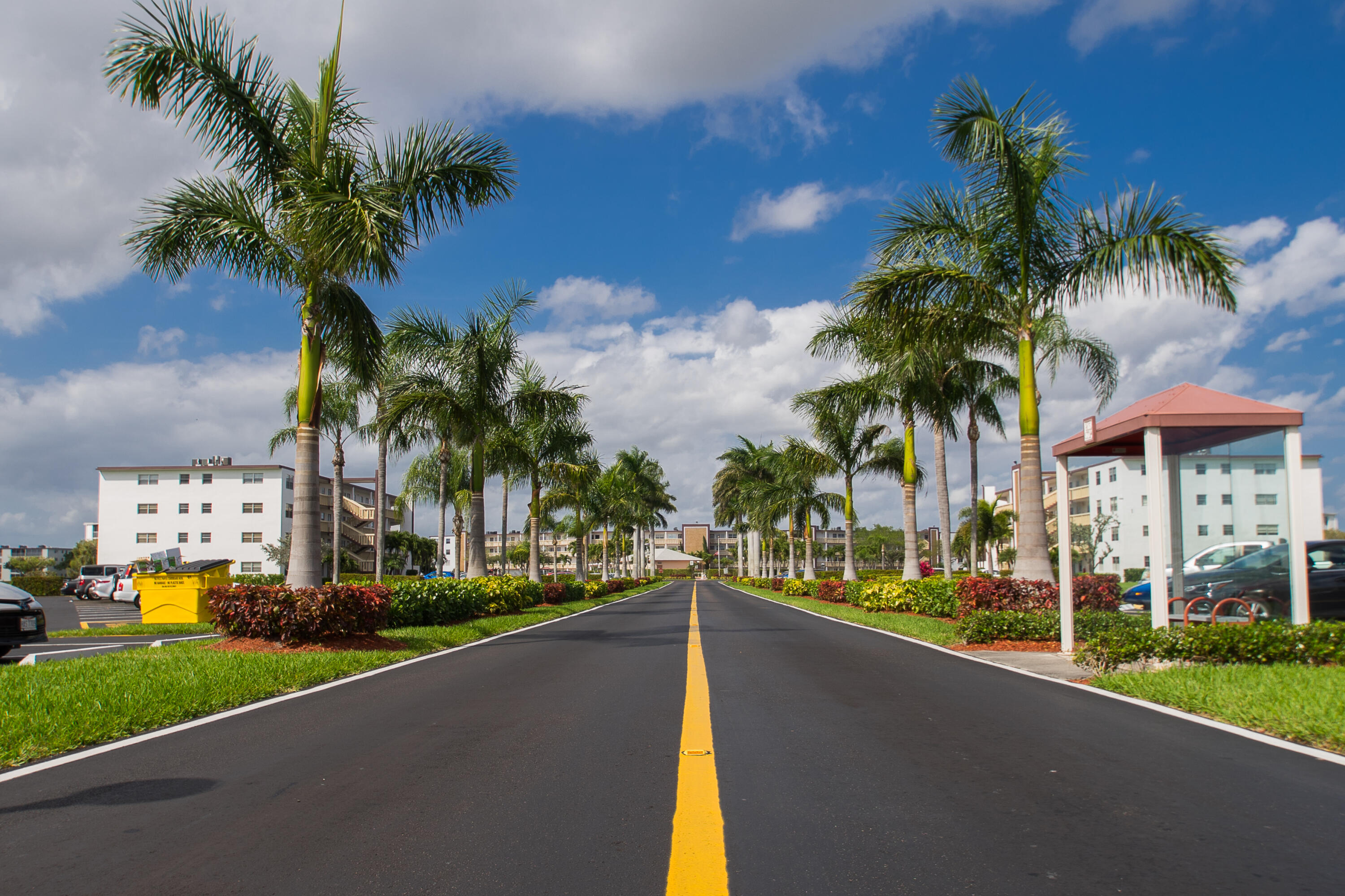 2061 Wolverton East Boca Raton, FL 33434 - Photo 1 of 1 a view of a street with a building and palm trees