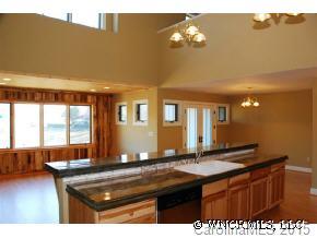34 Live View Lane Clyde, NC 28721 - Photo 3 of 12 a kitchen view with granite countertop a sink and cabinets
