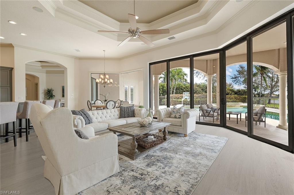 16540 Cellini Lane Naples, FL 34110 - Photo 13 of 50 a living room with furniture large windows and view of living room