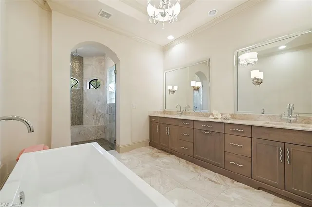 a spacious bathroom with a double vanity sink shower and a mirror