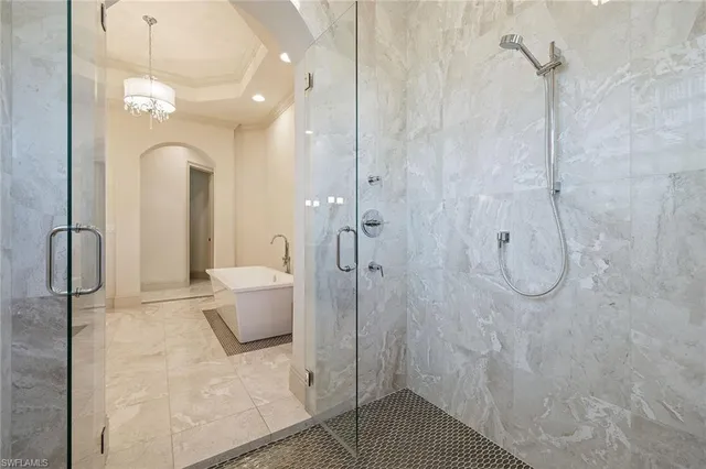 a bathroom with a granite countertop shower a toilet and sink