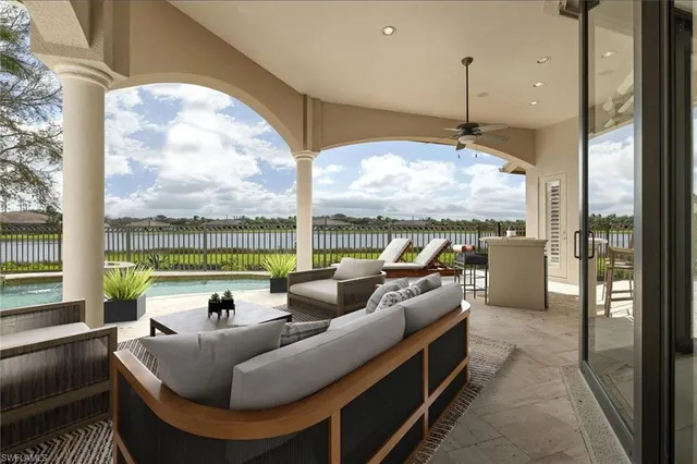 a living room with couch and a large window