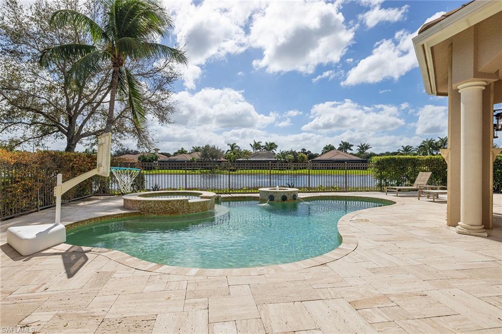 16540 Cellini Lane Naples, FL 34110 - Photo 31 of 50 a view of a swimming pool with a yard