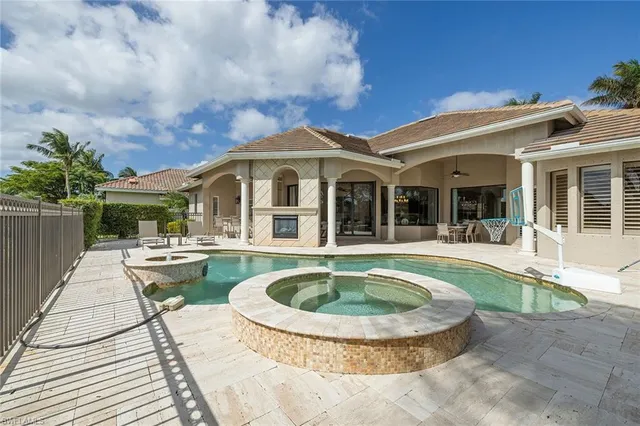 a view of a house with swimming pool and porch
