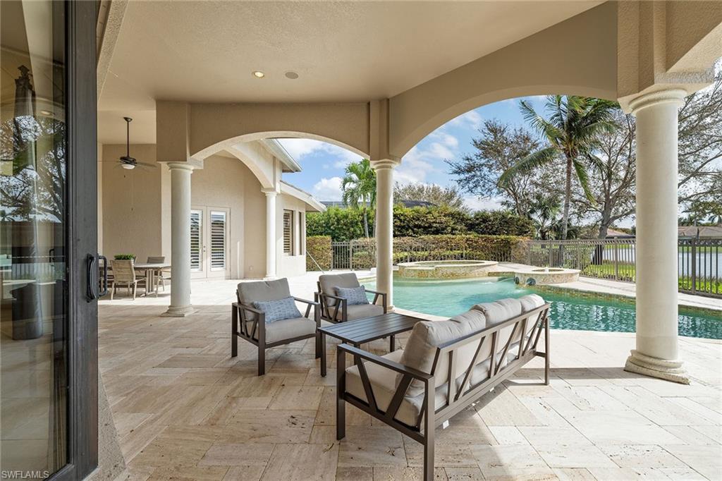 16540 Cellini Lane Naples, FL 34110 - Photo 40 of 50 a outdoor space with patio the couches and dining table with garden view