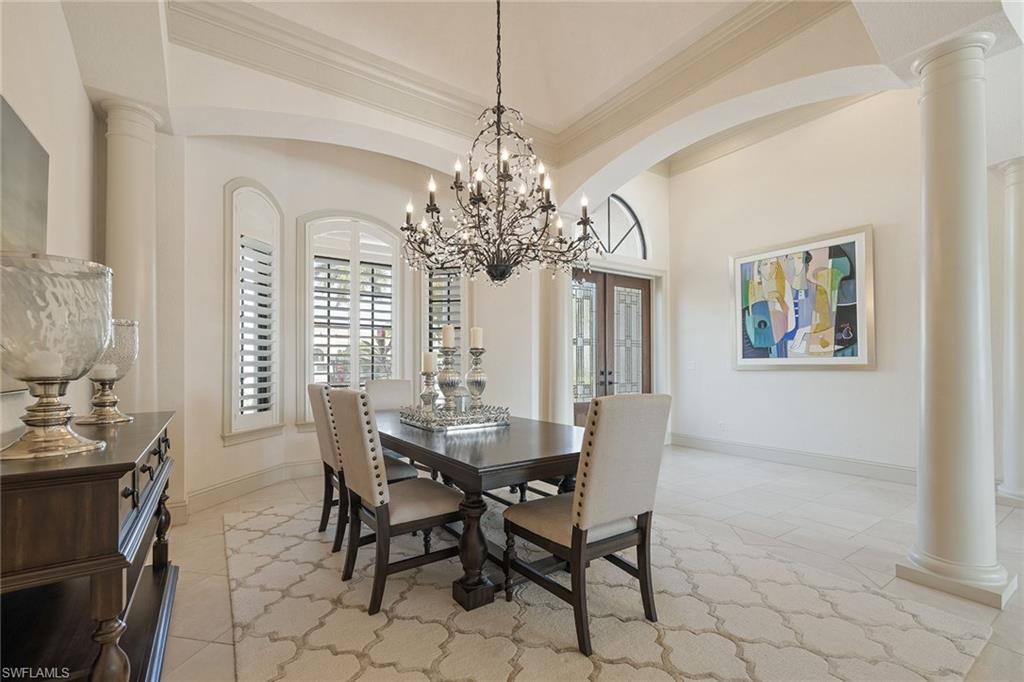 16540 Cellini Lane Naples, FL 34110 - Photo 5 of 50 a view of a dining room with furniture and chandelier