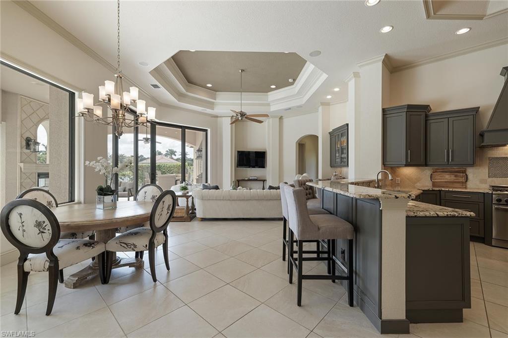 16540 Cellini Lane Naples, FL 34110 - Photo 8 of 50 a view of a dining room with furniture window and wooden floor