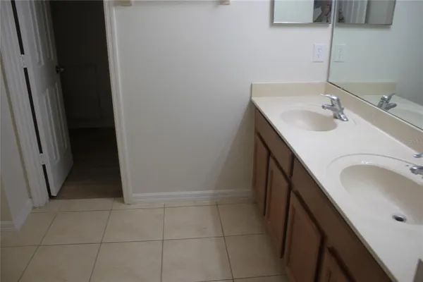 a bathroom with a sink a vanity and a mirror
