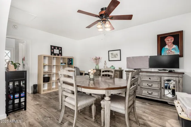 a view of a livingroom with furniture and a flat screen tv