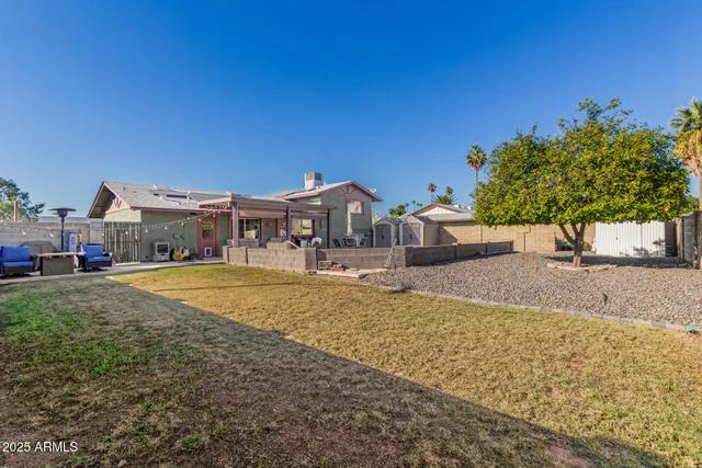 a aerial view of a house with a yard