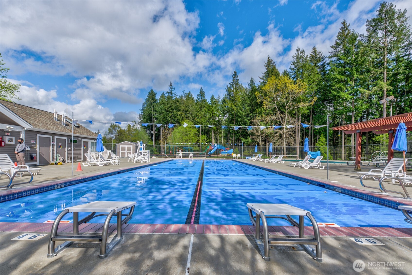 4423 249th Terrace Southeast Issaquah, WA 98029 - Photo 26 of 27 a view of a swimming pool with a lounge chairs