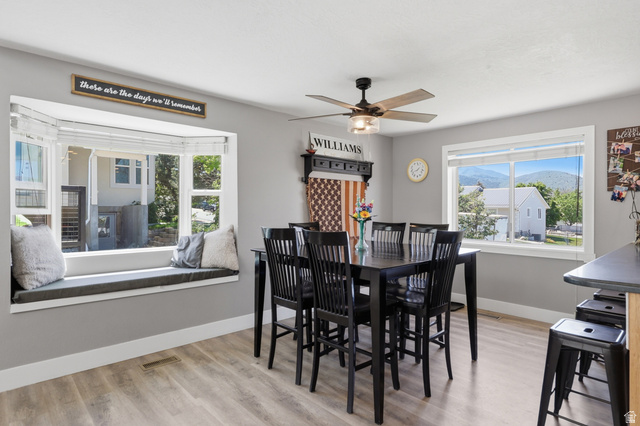 114 North Clark Lane Elk Ridge, UT 84651 - Photo 6 of 26 Dining area featuring light wood-finish flooring and a contemporary ceiling fan