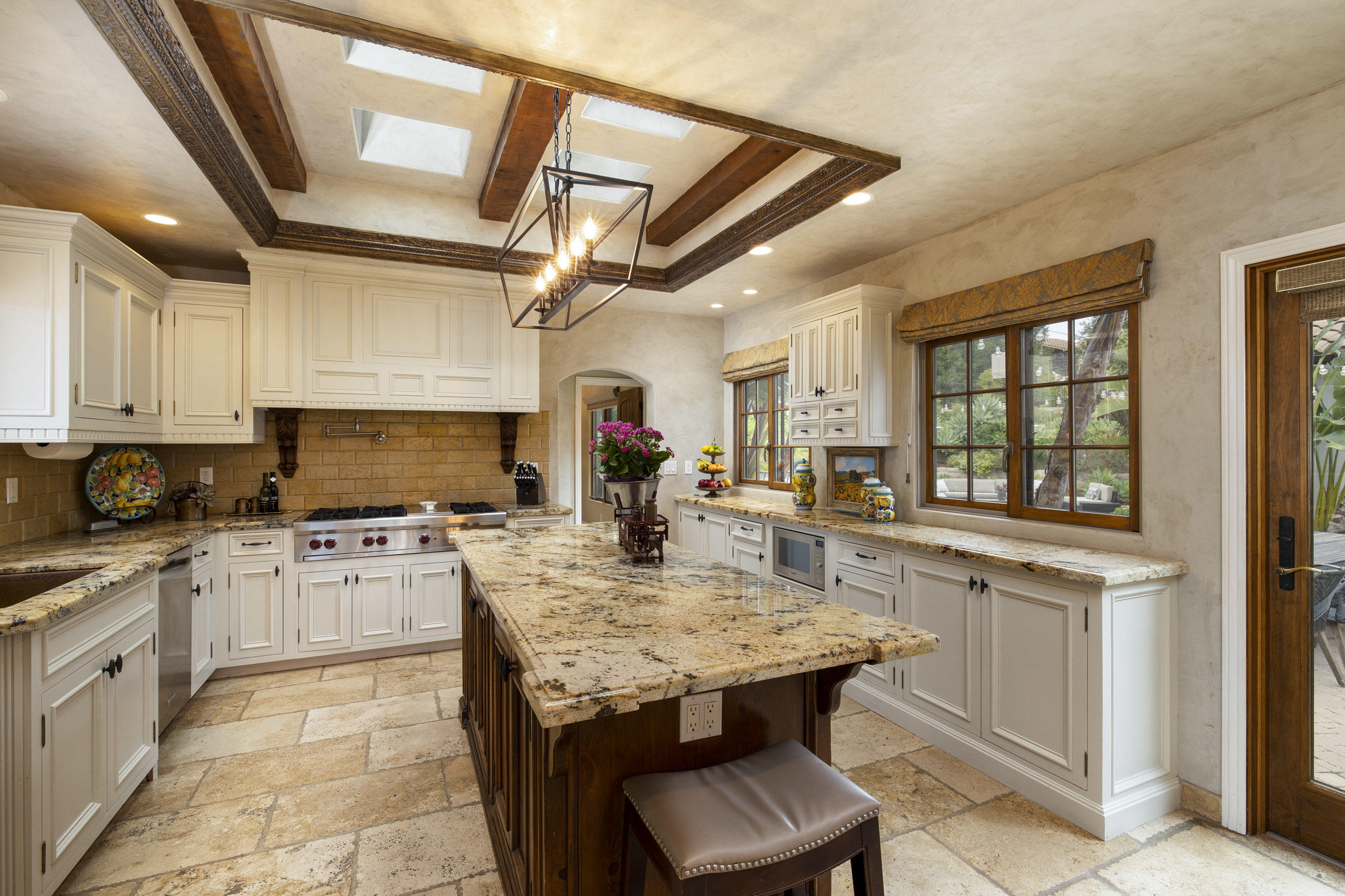 2519 Foothill Lane Santa Barbara, CA 93105 - Photo 11 of 35 a kitchen with granite countertop a stove dining table and chairs