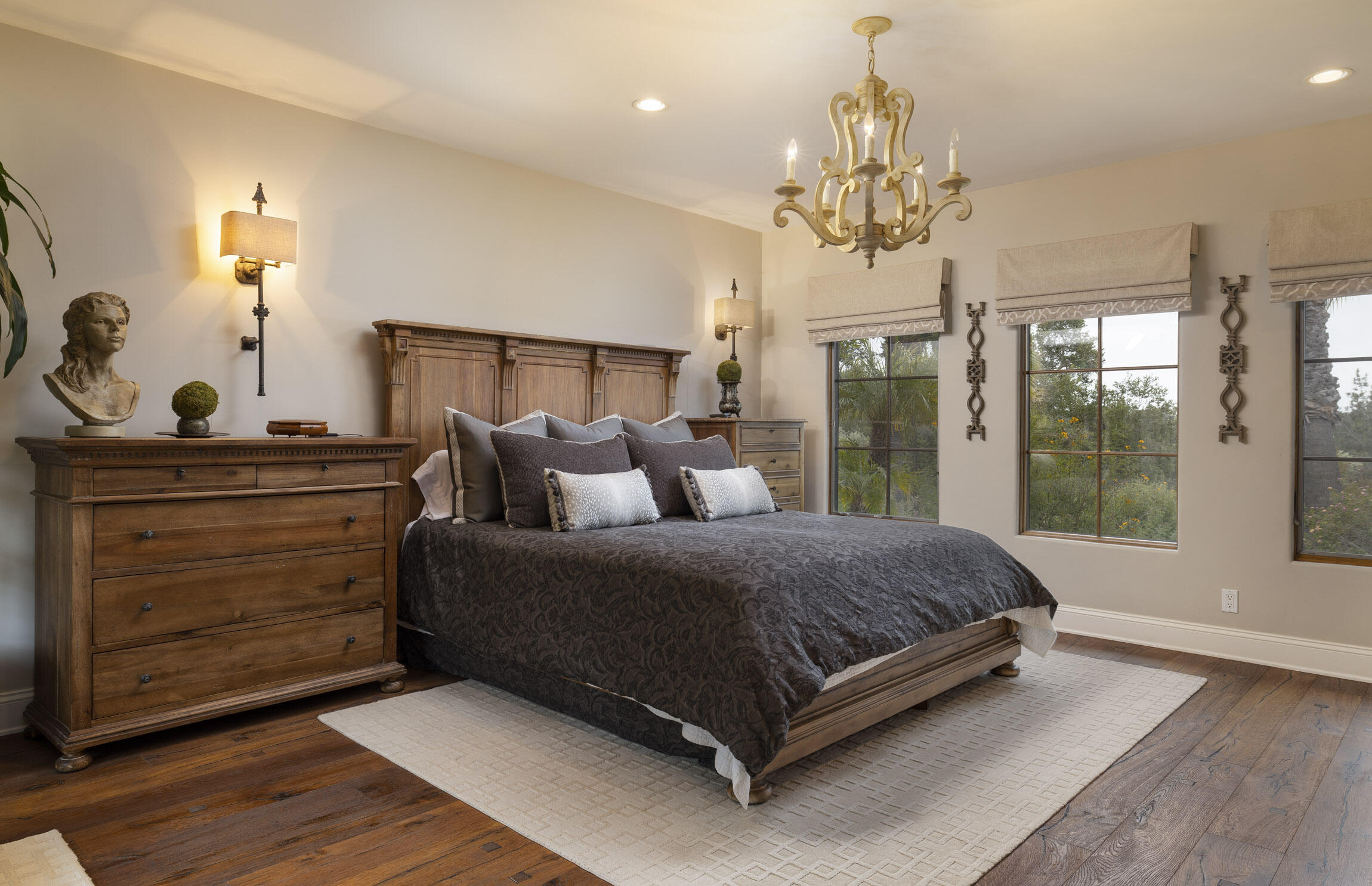 2519 Foothill Lane Santa Barbara, CA 93105 - Photo 20 of 35 a spacious bedroom with a balcony a bed and a chandelier