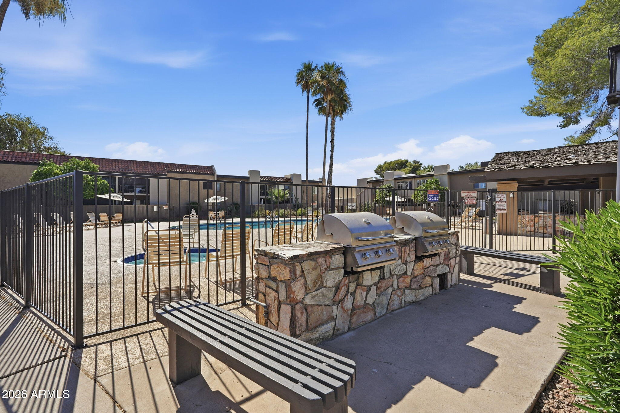4201 East Camelback Road, Unit 34 Phoenix, AZ 85018 - Photo 17 of 19 a view of a chairs and table in patio