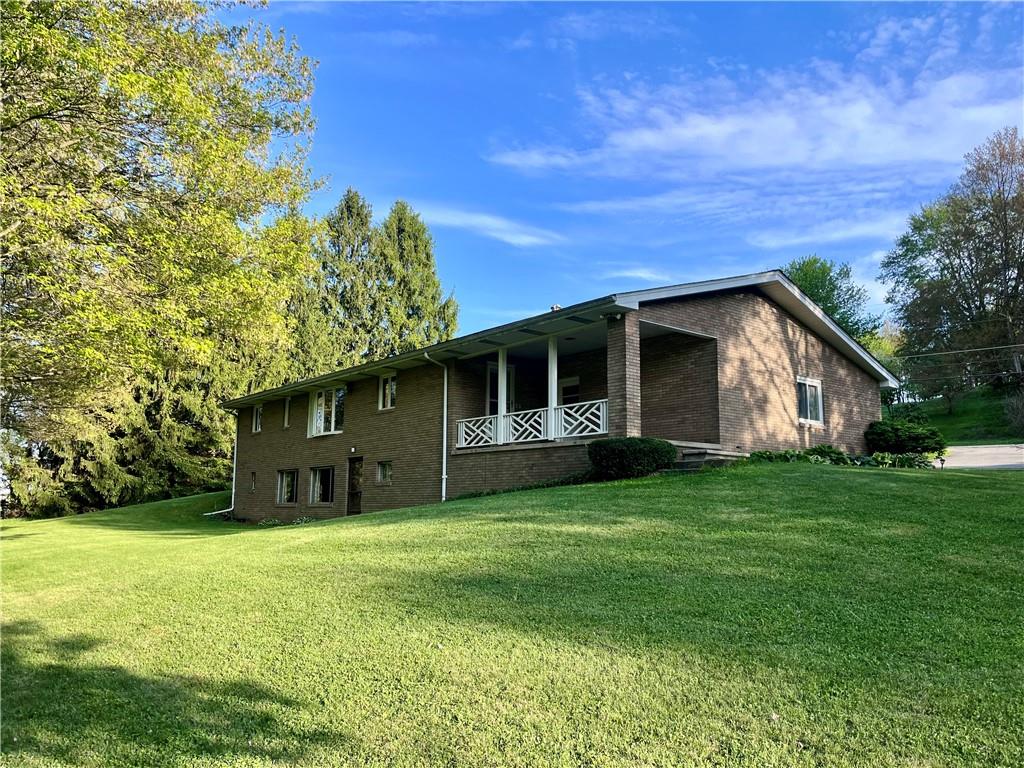 143 Schnur Road Butler, PA 16002 - Photo 15 of 50 a front view of a house with a garden