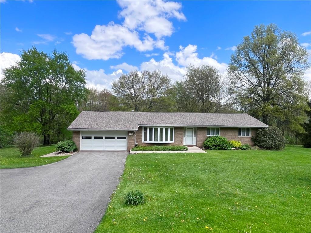 143 Schnur Road Butler, PA 16002 - Photo 19 of 50 a front view of a house with garden