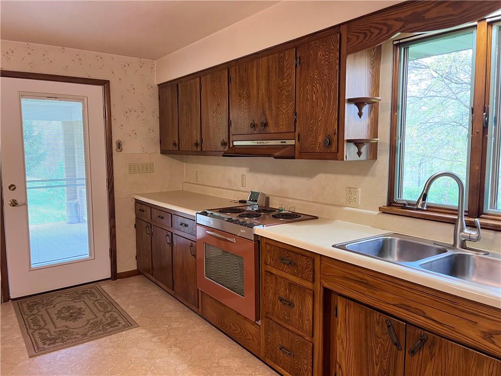143 Schnur Road Butler, PA 16002 - Photo 22 of 50 a kitchen with stainless steel appliances granite countertop a sink stove and cabinets