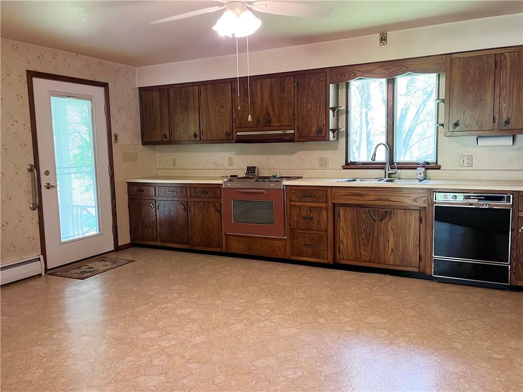 143 Schnur Road Butler, PA 16002 - Photo 28 of 50 a kitchen with stainless steel appliances granite countertop a stove a sink dishwasher and a microwave oven