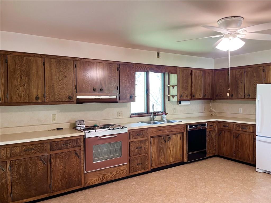 143 Schnur Road Butler, PA 16002 - Photo 29 of 50 a kitchen with stainless steel appliances granite countertop wooden cabinets a sink and dishwasher