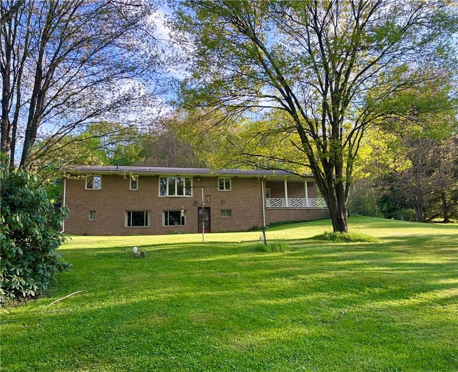 143 Schnur Road Butler, PA 16002 - Photo 3 of 50 a front view of a house with a big yard