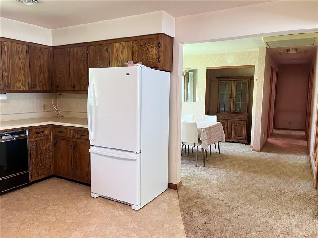 143 Schnur Road Butler, PA 16002 - Photo 33 of 50 a white refrigerator freezer sitting in a kitchen