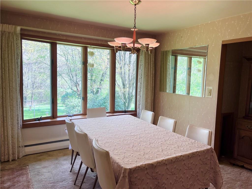143 Schnur Road Butler, PA 16002 - Photo 35 of 50 a dining room with a window and a table
