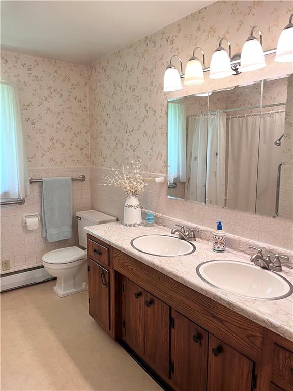 143 Schnur Road Butler, PA 16002 - Photo 36 of 50 a bathroom with a double vanity sink mirror and toilet