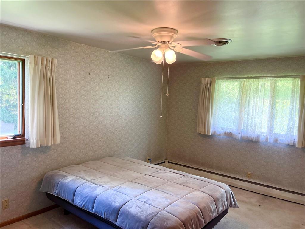 143 Schnur Road Butler, PA 16002 - Photo 39 of 50 a bedroom with a bed and a window