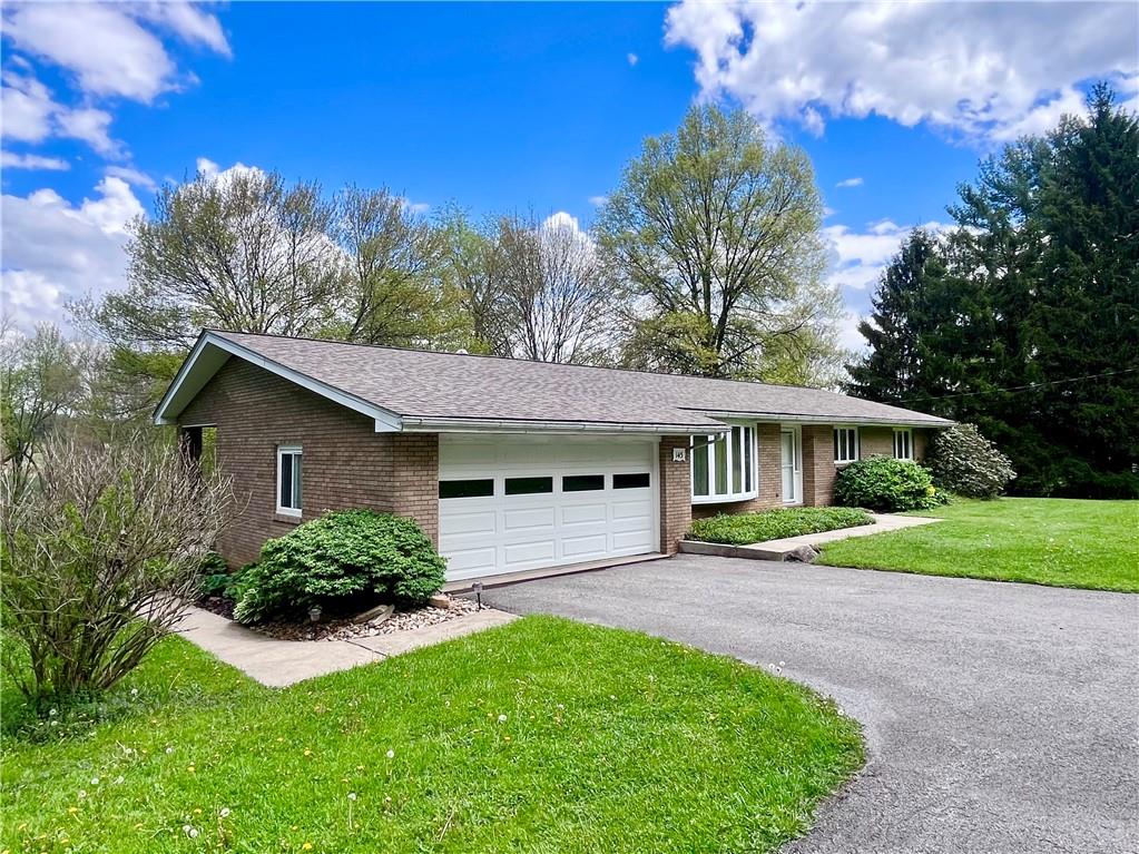 143 Schnur Road Butler, PA 16002 - Photo 50 of 50 a front view of a house with garden