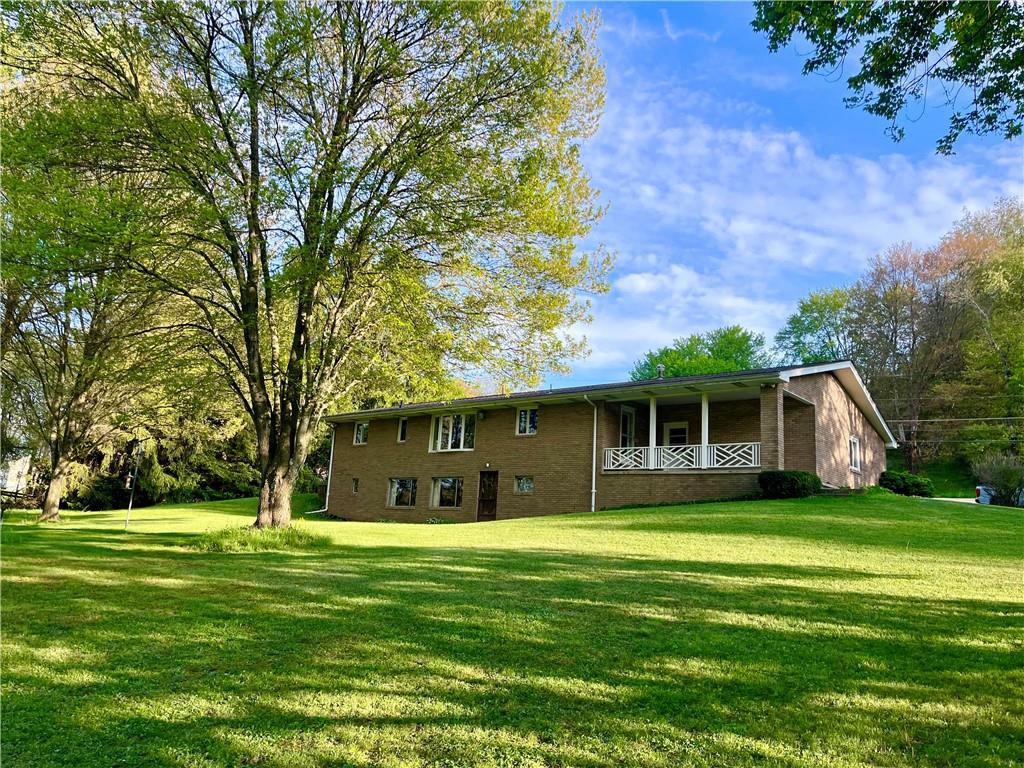 143 Schnur Road Butler, PA 16002 - Photo 5 of 50 a front view of house with a garden