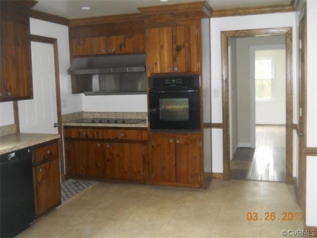 15519 Baltimore Road Dewitt, VA 23840 - Photo 11 of 13 a kitchen with granite countertop a stove and a sink