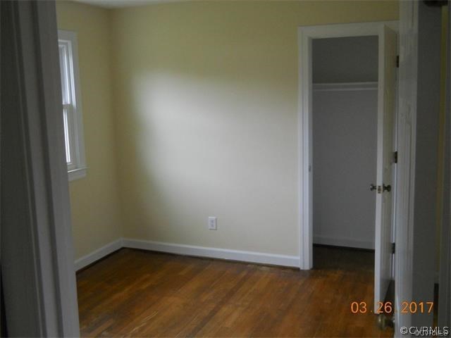 15519 Baltimore Road Dewitt, VA 23840 - Photo 12 of 13 a view of a small space with wooden floor and a window