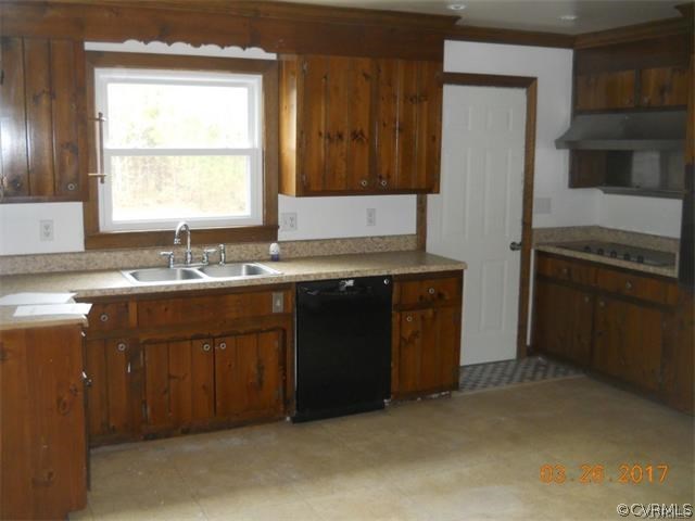 15519 Baltimore Road Dewitt, VA 23840 - Photo 10 of 13 a kitchen with a sink stove and refrigerator