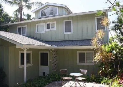 a view of a house with a backyard