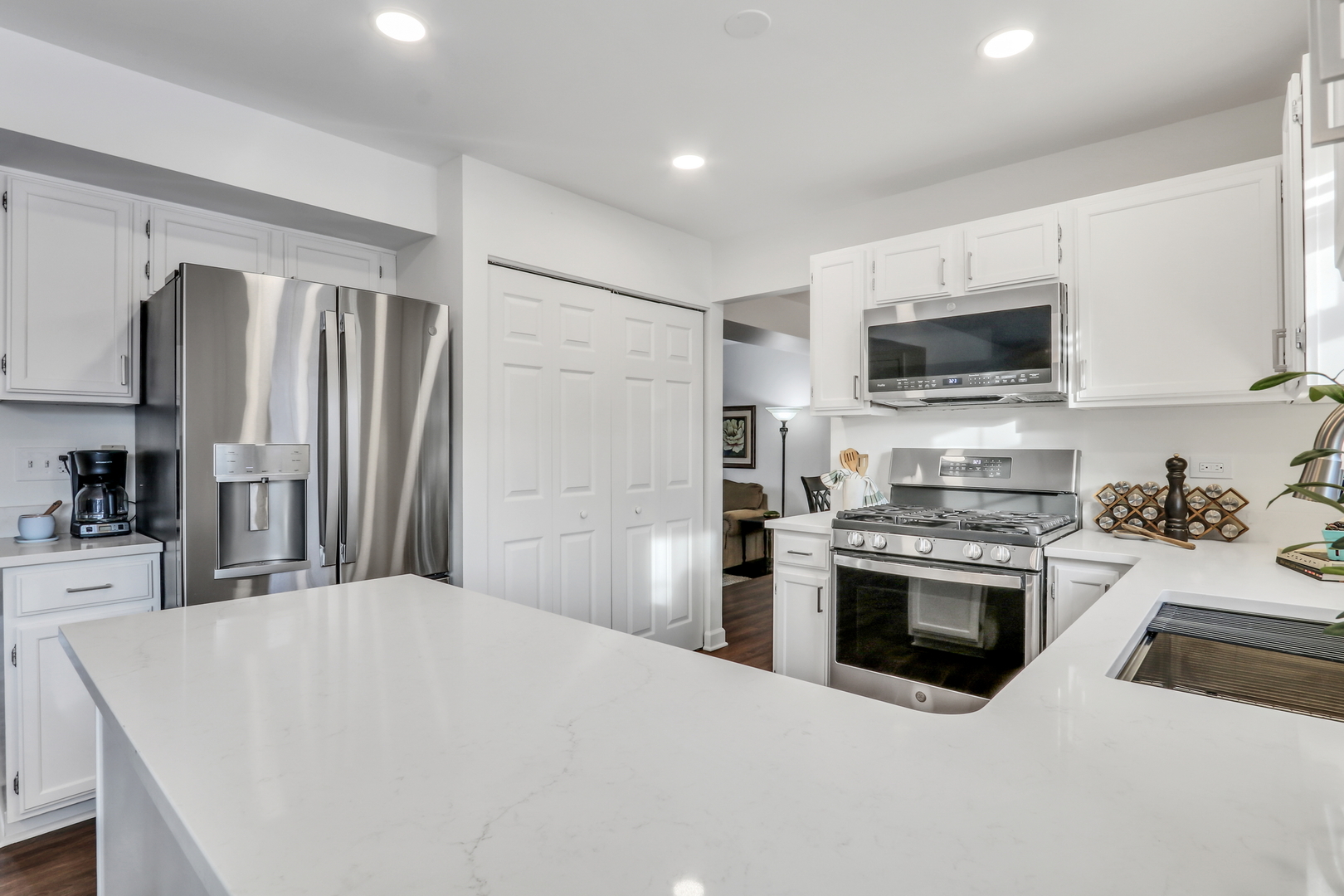 269 Braxton Way Grayslake, IL 60030 - Photo 12 of 38 a kitchen with stainless steel appliances a stove sink microwave refrigerator and cabinets