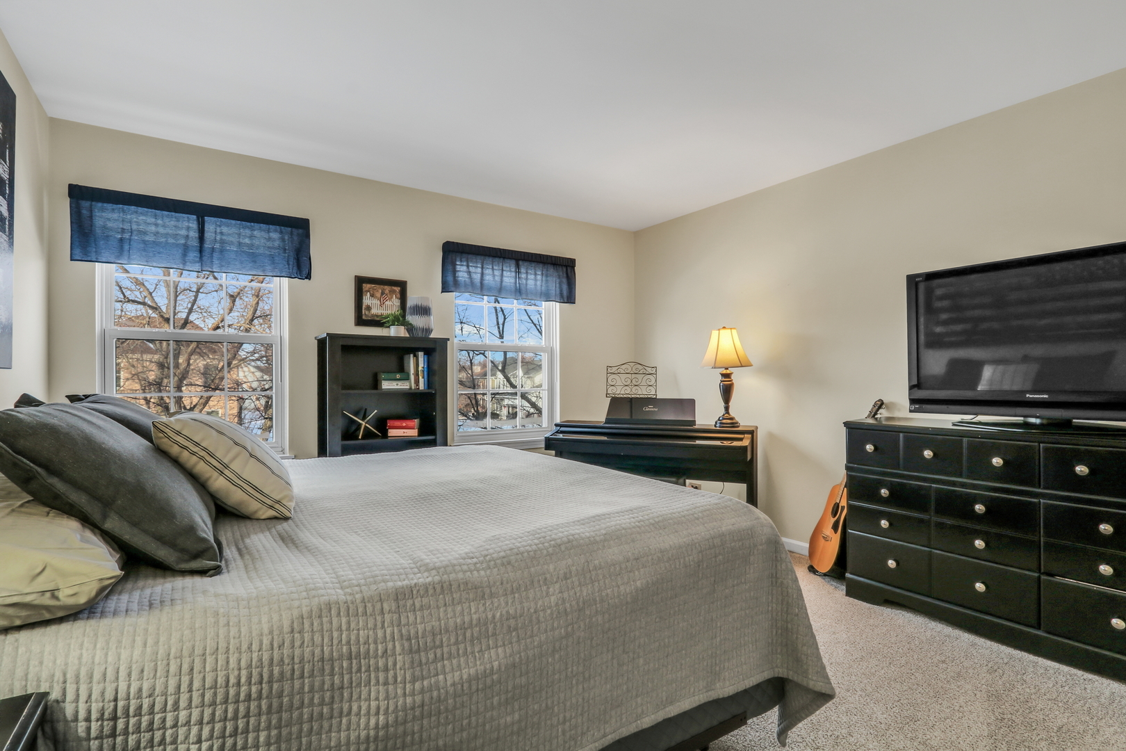 269 Braxton Way Grayslake, IL 60030 - Photo 24 of 38 a bedroom with a bed and a television