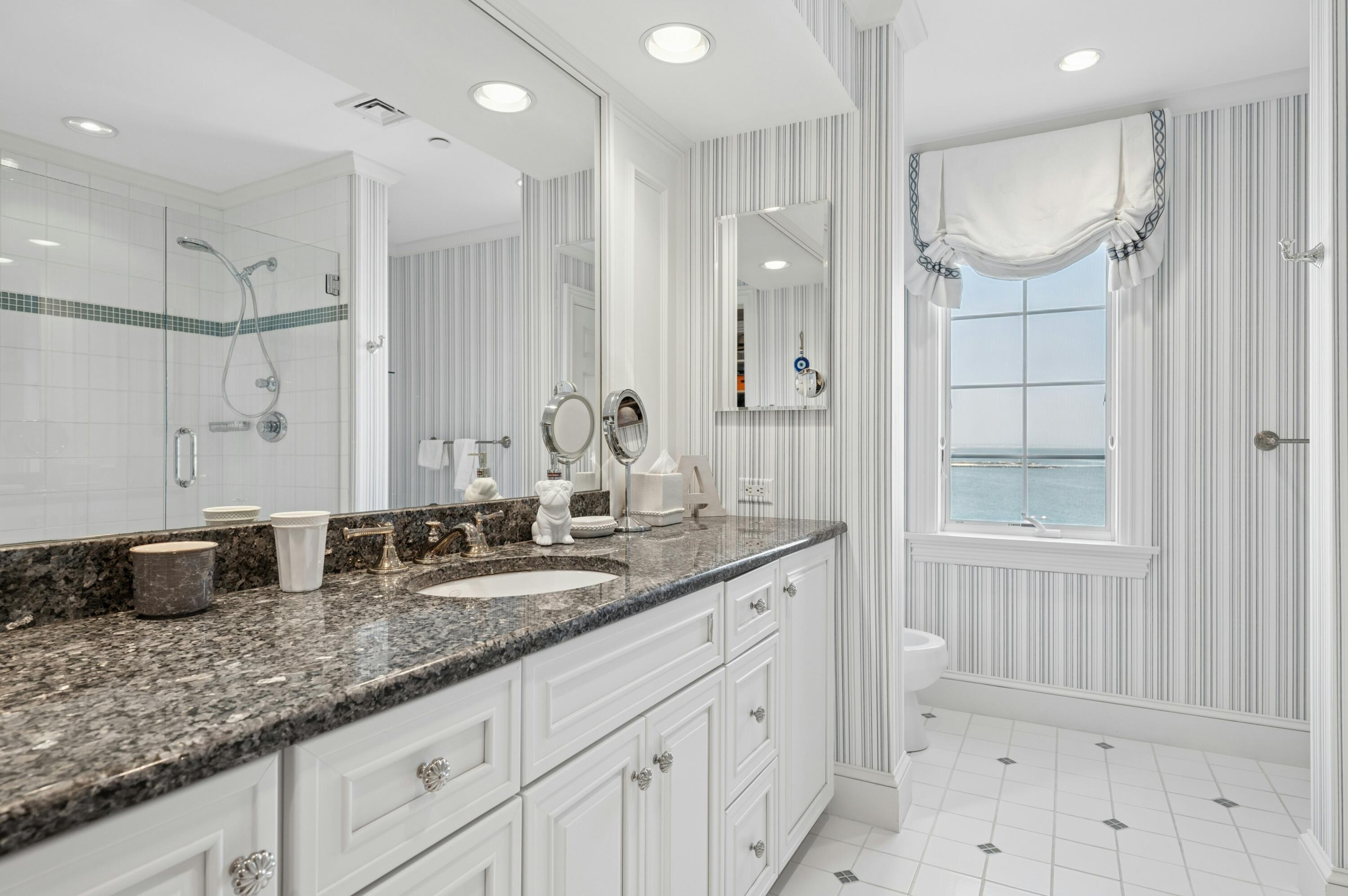23 Snow Inn Road, Unit 7 Harwich Port, MA 02646 - Photo 20 of 37 a bathroom with double vanity and a mirror